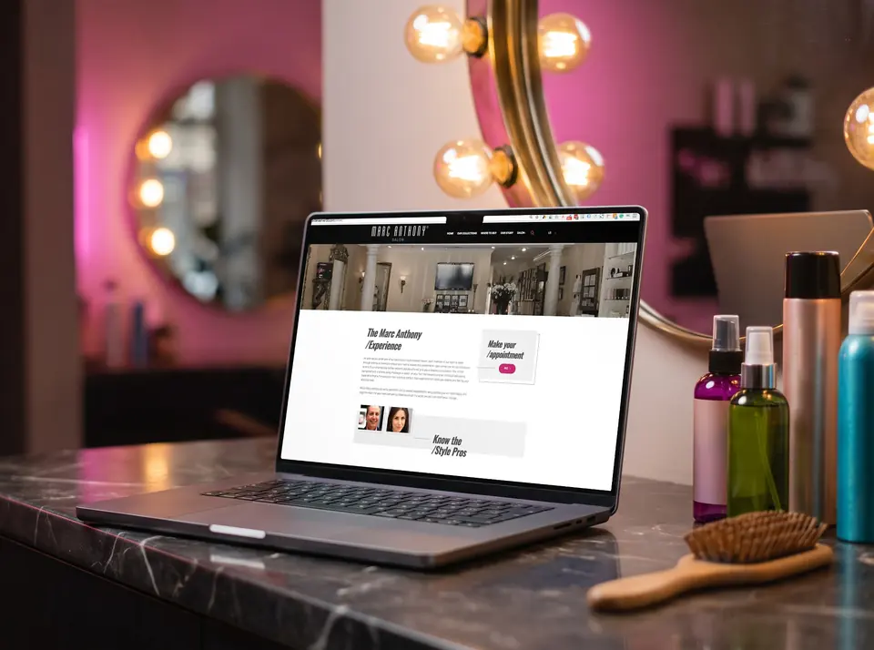 Marc Anthony True Professional website on a laptop and phone